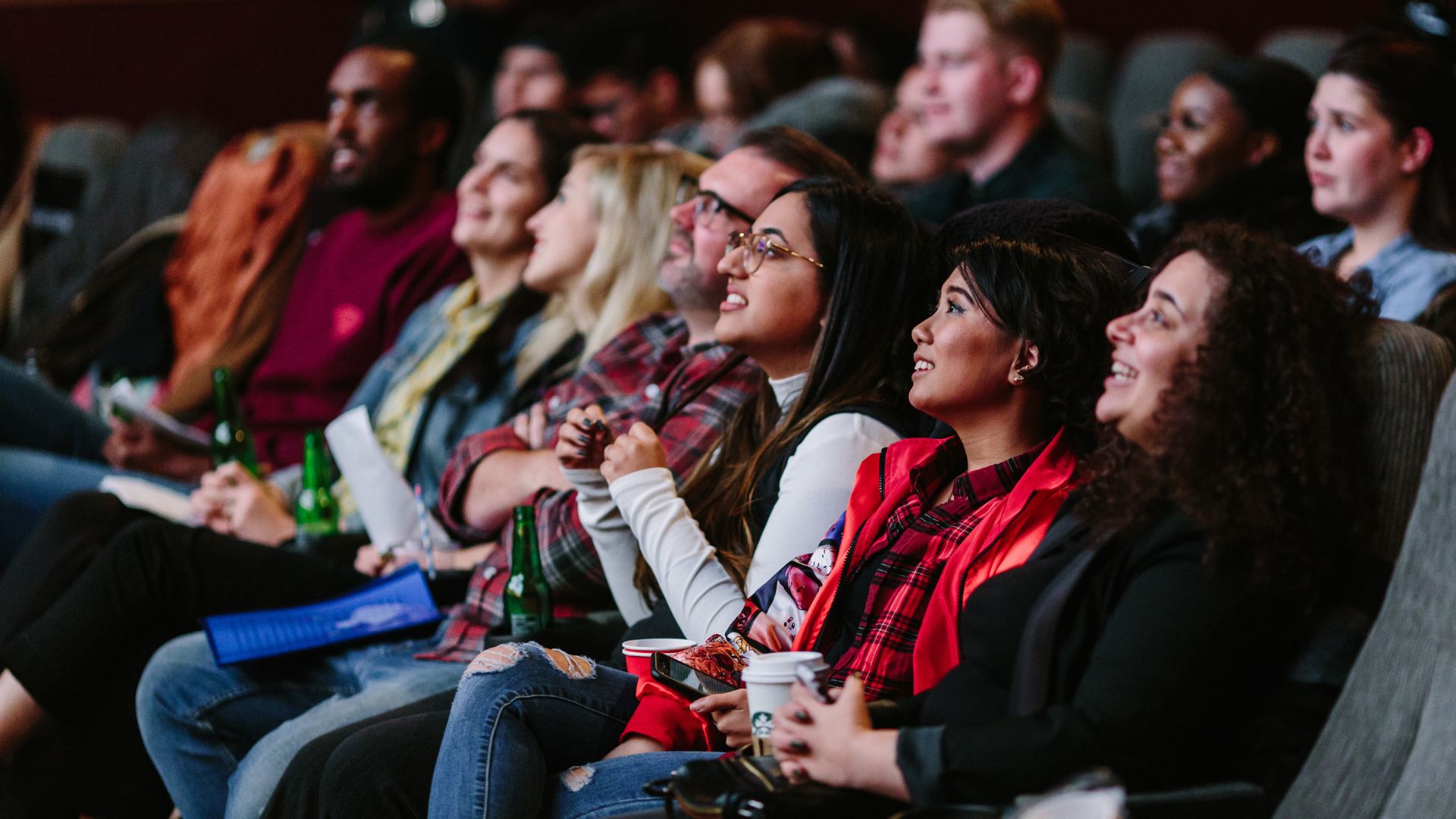 People are watching film in the cinema hall