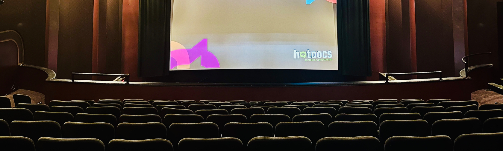 Backs of students heads as they sit in the cinema