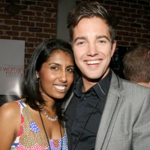 Philip Lyall & Nimisha Mukerji side-by-side smiling widely