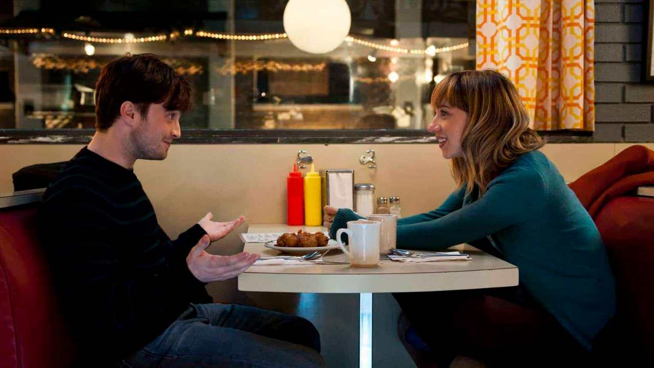 Daniel Radcliffe and a woman having dinner
