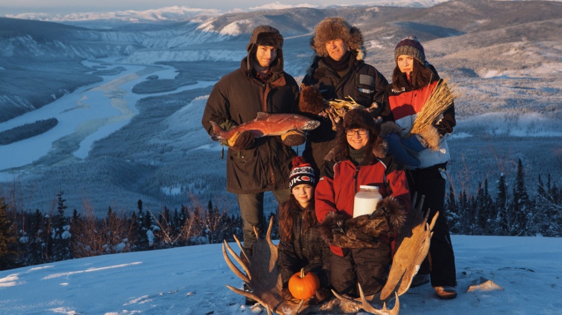 a group of people standing in the snow
