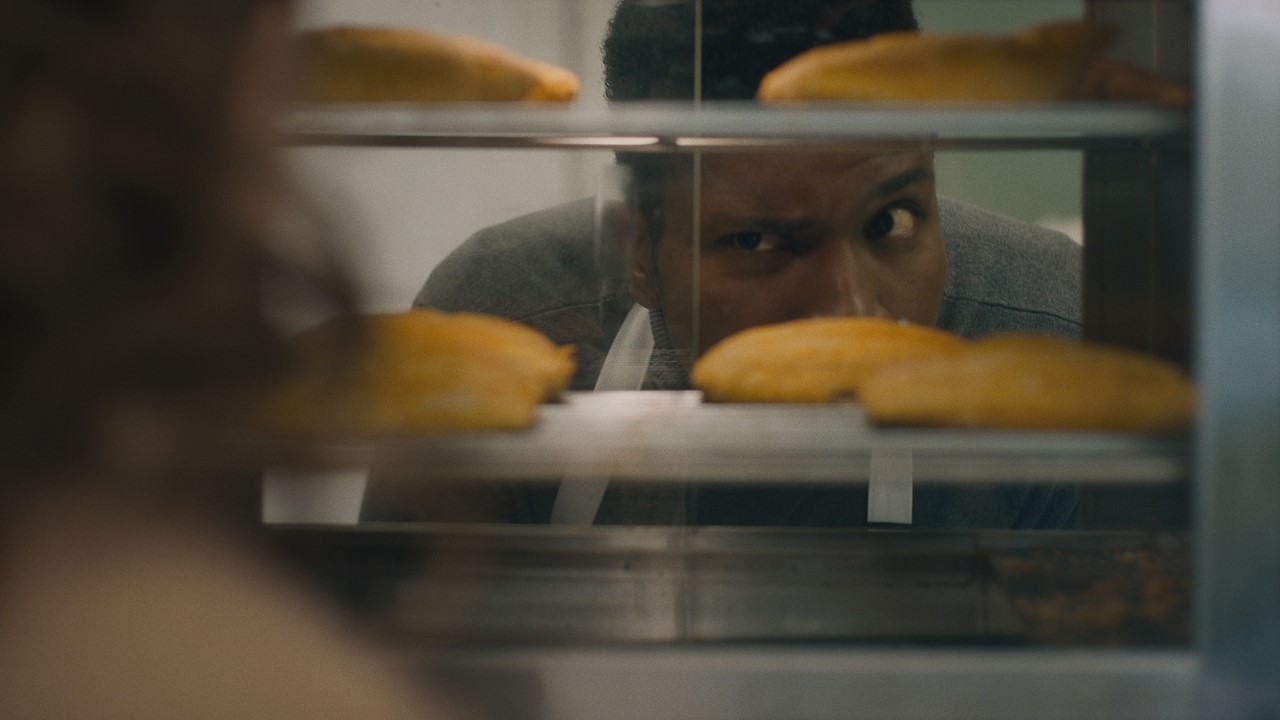 Man looking at Jamaican Patties